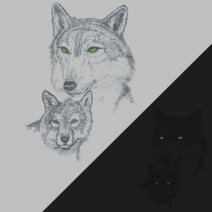 Detail of Green Eyed Wolf wildlife t-shirt design, featuring a mama wolf and her cub, both with glow in the dark eyes