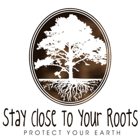 Detail of Stay Close to Your Roots t-shirt design, featuring a cameo with a large tree and a cross section of its roots with the text "stay close to your roots" and "protect your earth" below