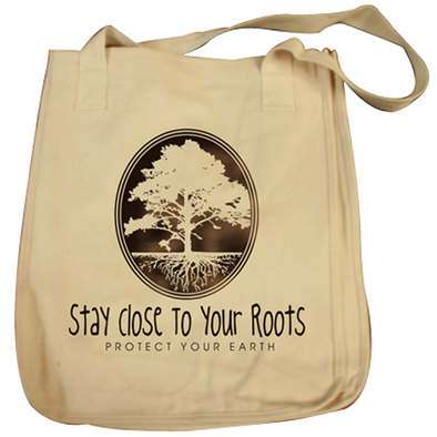 Detail of Stay Close to Your Roots t-shirt design, featuring a cameo with a large tree and a cross section of its roots with the text "stay close to your roots" and "protect your earth" below